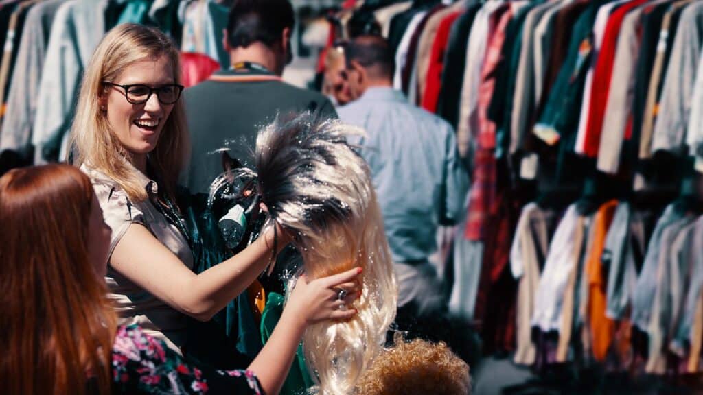Woman selecting a wig and costumes