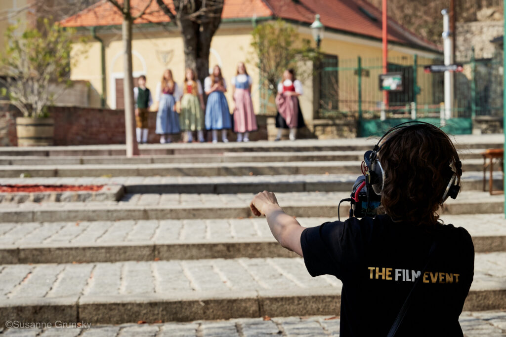 Filmmaker filming participants