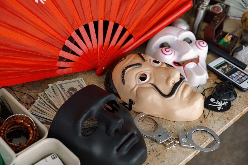 Costumes and masks on a table for display