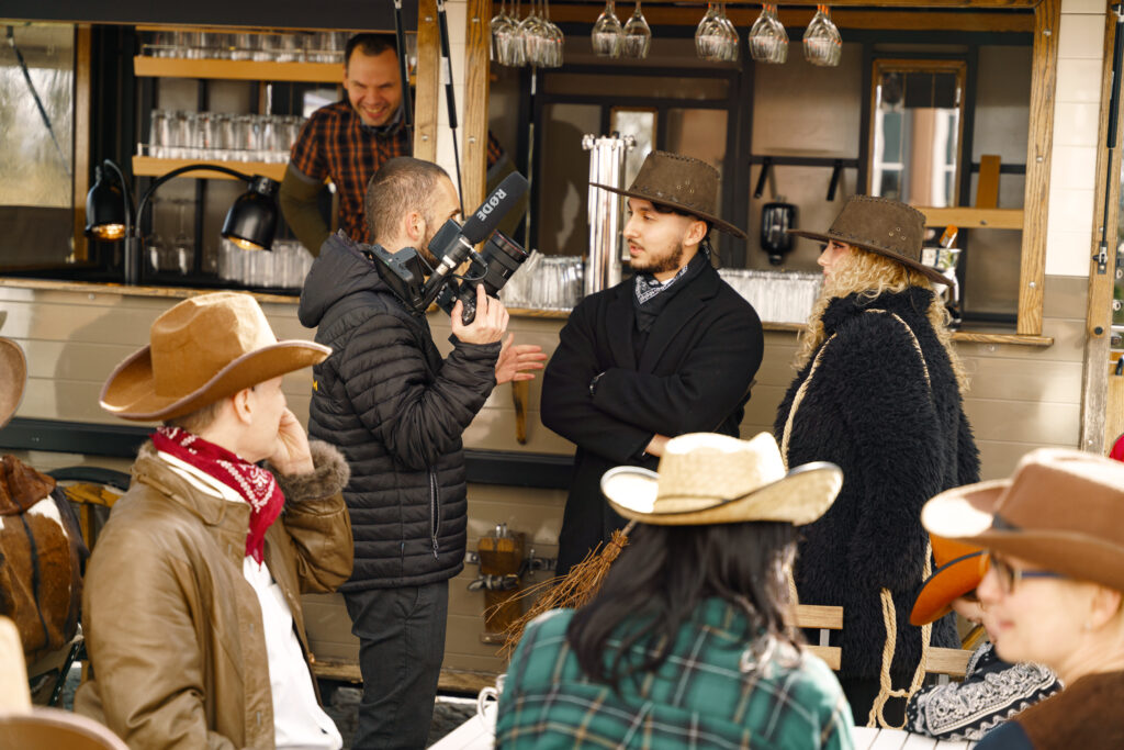 Filmmaker talking to the team, explaining a Western scene